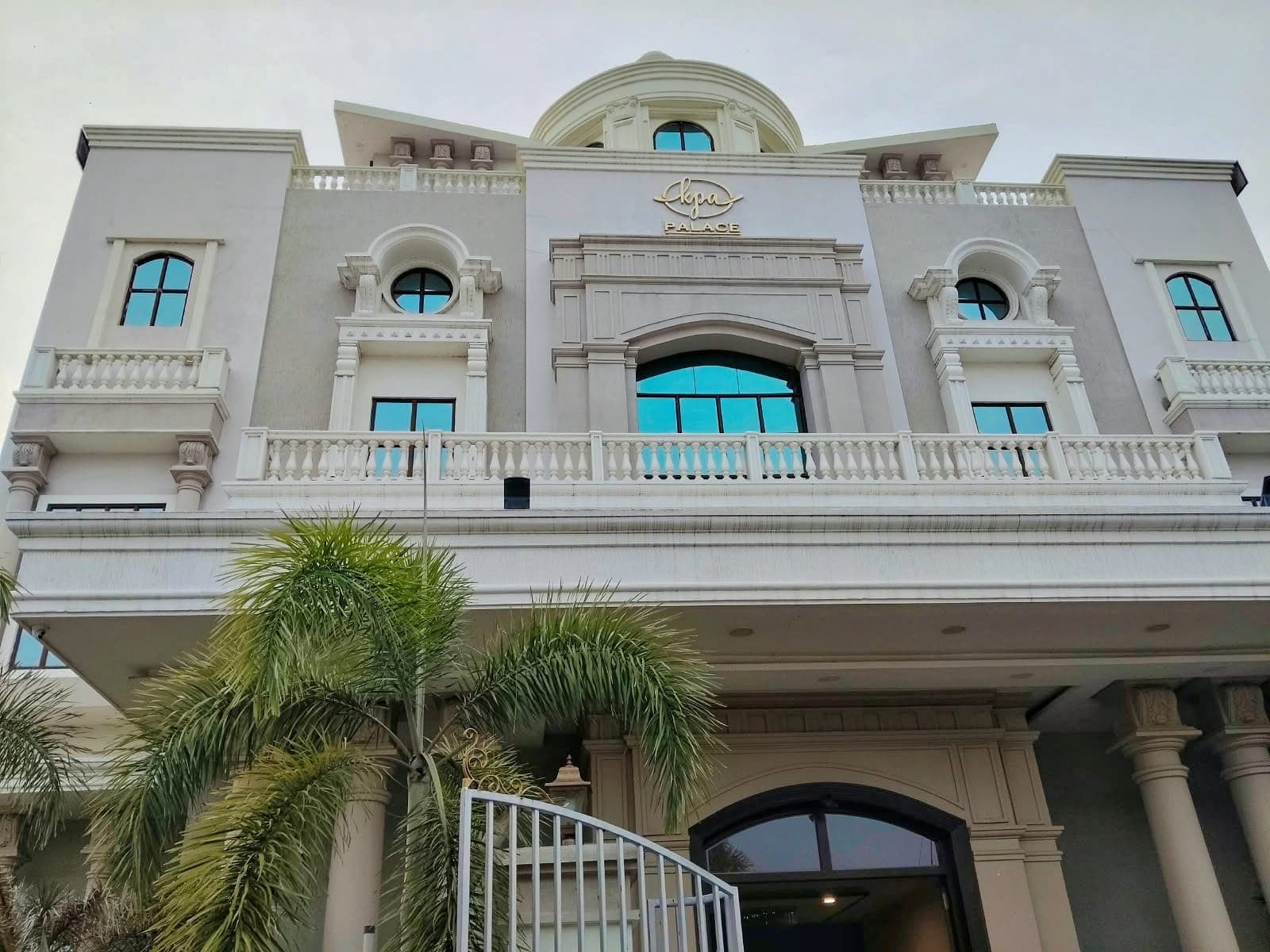 KPA Palace building with its gold logo, balconies and dome in New Town, Vaniyambadi